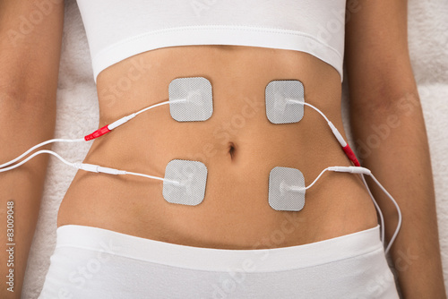 Woman With Electrodes On Her Stomach photo