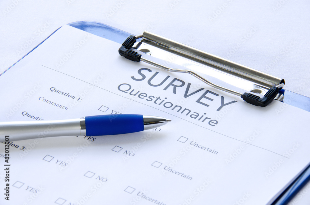 Generic survey questionnaire on clipboard with pen Generic survey questionnaire on clipboard with pen