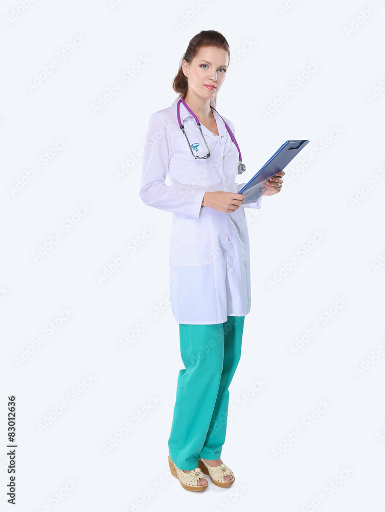 Smiling female doctor with a folder in uniform standing at Smiling female doctor with a folder in uniform standing at