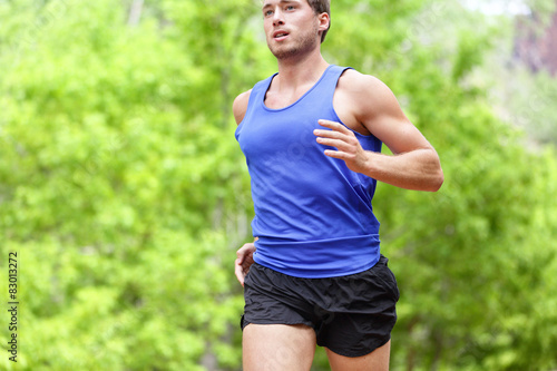 Man running on road - Sport and fitness runner