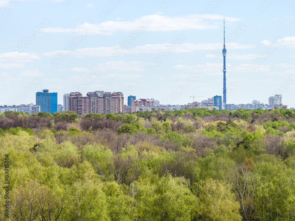 modern city and green woods in spring modern city and green woods in spring
