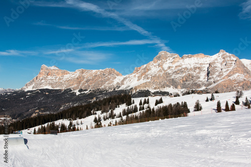Mountain peak with shadow, sun, sky and ski lift © GioRez