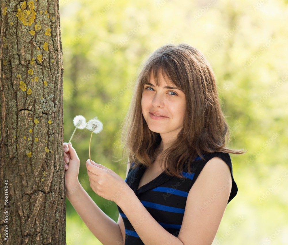 portrait of a beautiful girl with dandelions portrait of a beautiful girl with dandelions