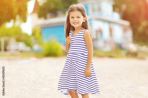 Summer travel portrait of beautiful little girl on the beach © rohappy