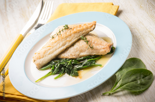fish fillet with fresh spinach