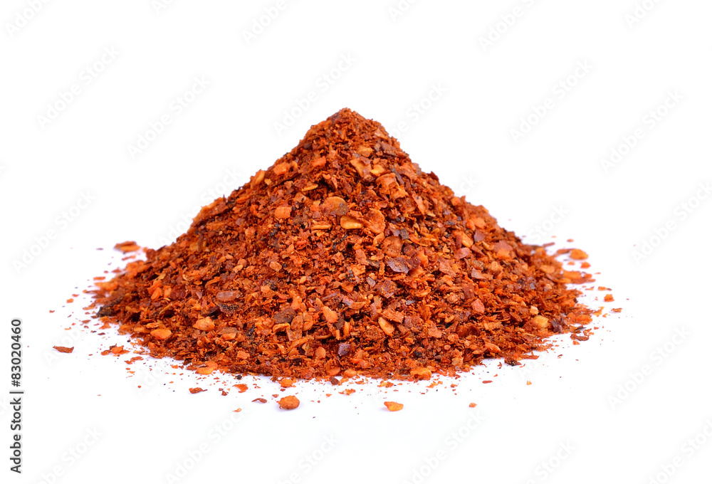 Powdered dried red pepper on white background Powdered dried red pepper on white background