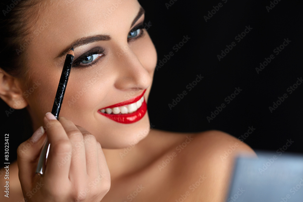 Make-up. Beautiful Woman Doing Makeup. Eyebrow Pencil. Red Lips
