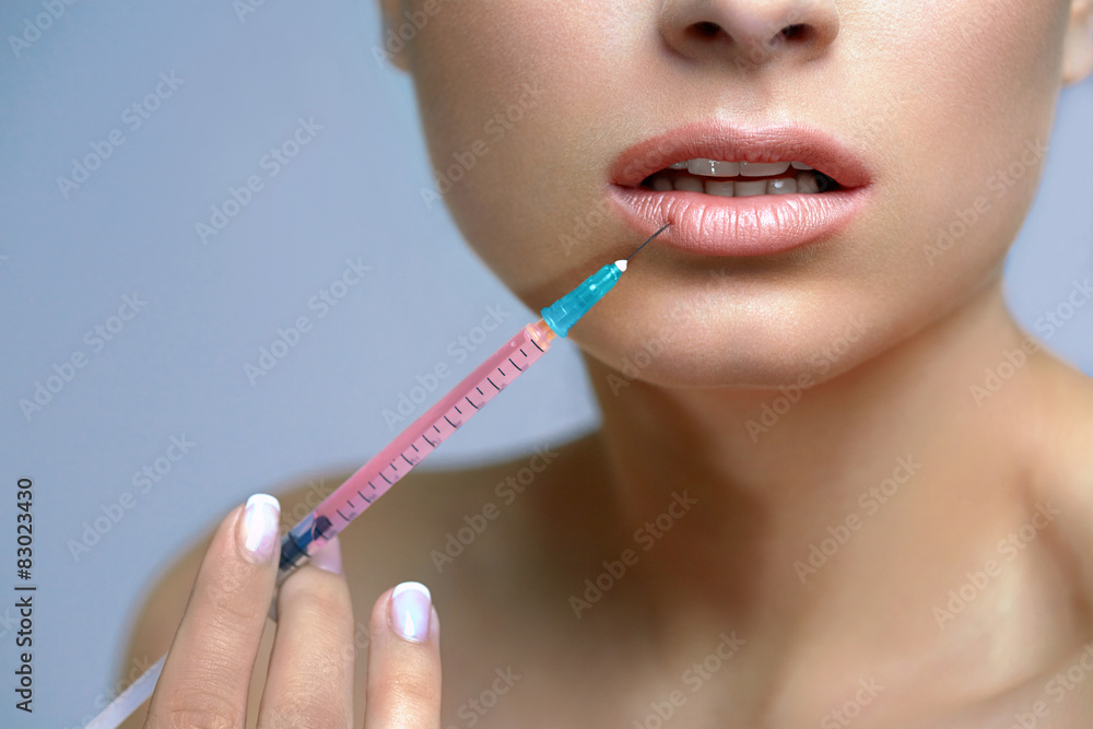 Beautiful Woman Gets Lips Injections. Cosmetology. Beauty Face Beautiful Woman Gets Lips Injections. Cosmetology. Beauty Face