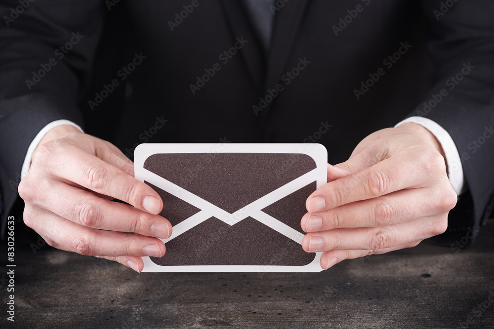Man holding email icon in hands