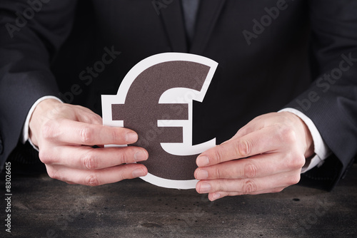 Obraz na płótnie Man holding euro icon in hands w salonie