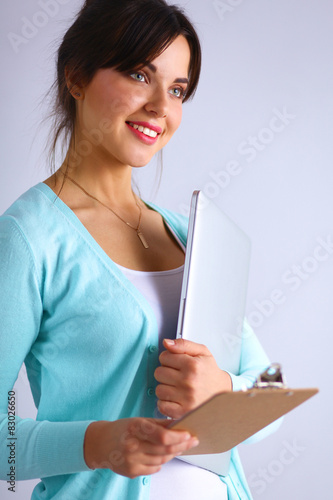 Woman with folder for documents on gray background