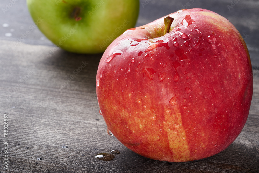Red apple on wooden table