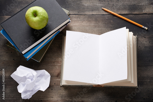 Open notebook on wooden table