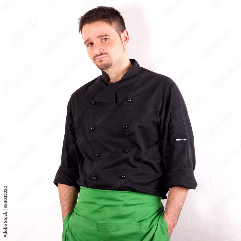 Studio shot of a young man with chef clothes Studio shot of a young man with chef clothes