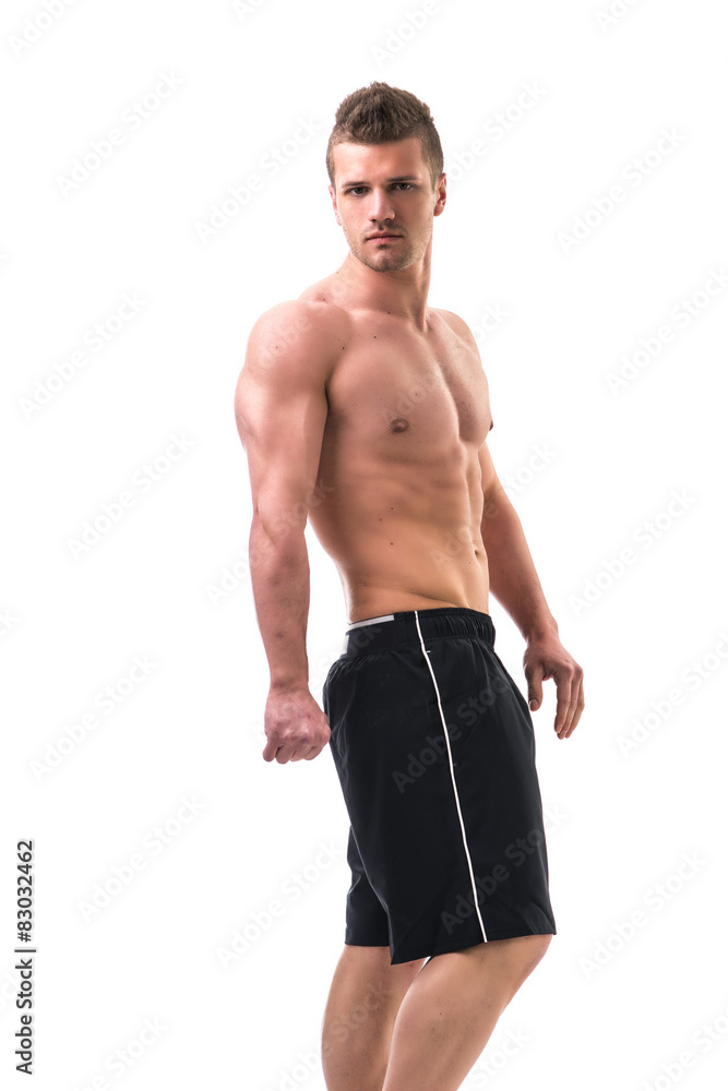Handsome bodybuilder doing tricep pose, isolated