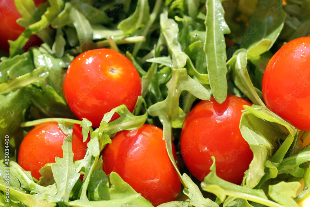 Fresh vegetable salad: rocket and сherry tomato Fresh vegetable salad: rocket and сherry tomato