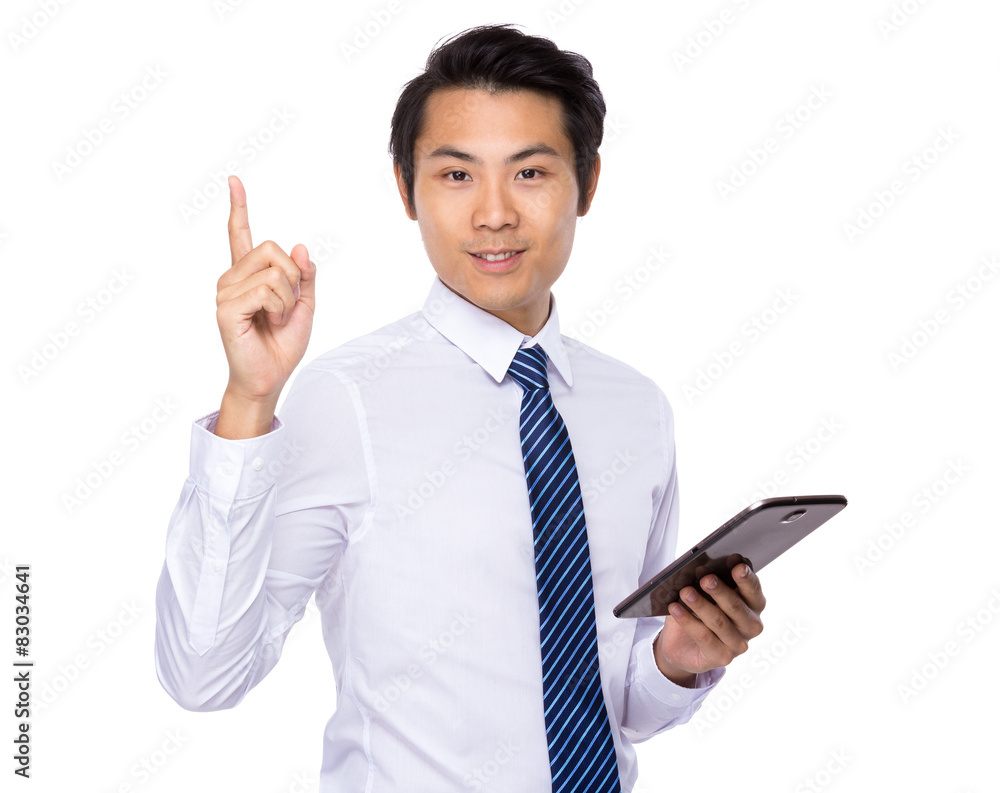 Asian businessman use of tablet and finger pointing up Asian businessman use of tablet and finger pointing up
