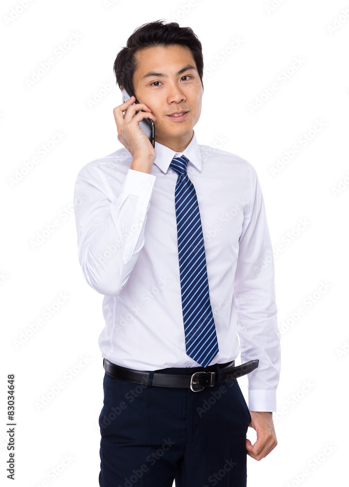 Young businessman talk to cellphone Young businessman talk to cellphone