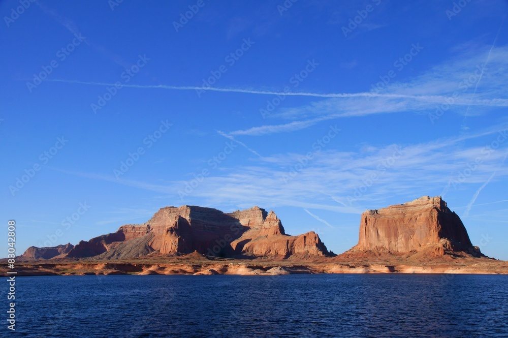 Lake Powell shoreline - a view from water in a bright sunny day.