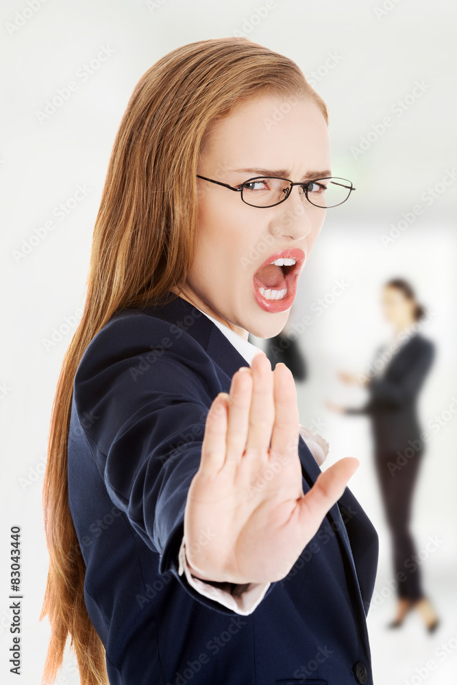 Businesswoman making stop sign.