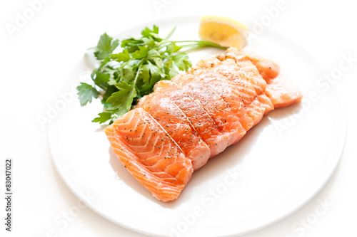 Salmon and shrimps pocket raw on white plate