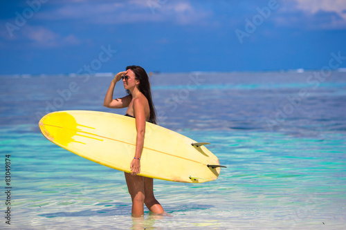 Beautiful surfer woman surfing during summer vacation © travnikovstudio