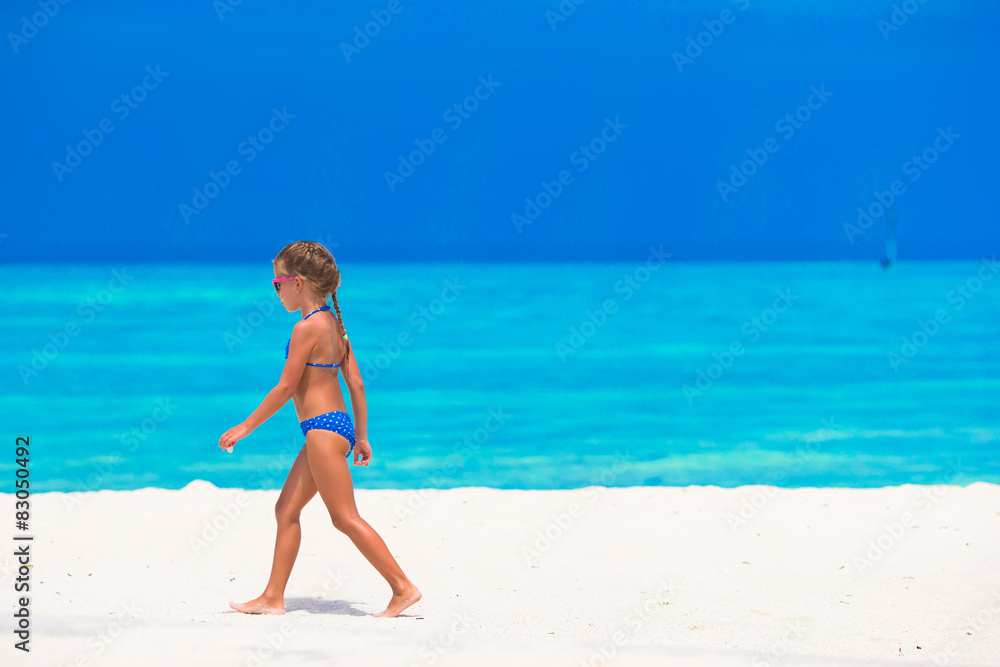 Adorable little girl at beach during summer vacation Adorable little girl at beach during summer vacation