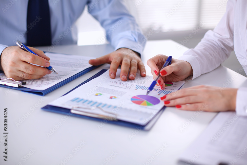 © lenetsnikolai - Group of business people working together in office