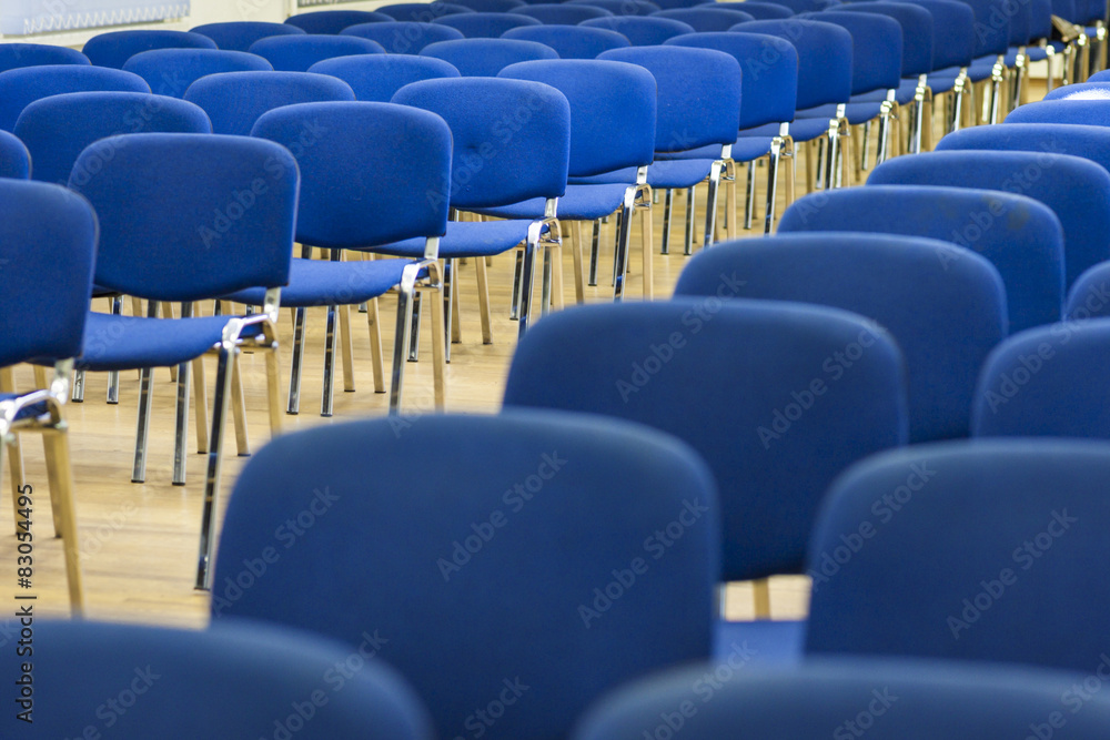 Row of Modern Chairs Standing in Line in The Empty Auditorium. Row of Modern Chairs Standing in Line in The Empty Auditorium.