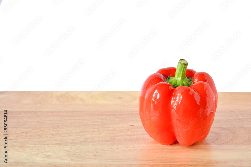 red pepper on wooden table red pepper on wooden table