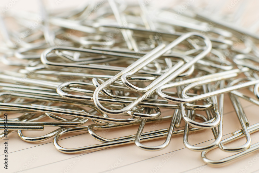 Paper clip and pink paper Paper clip and pink paper