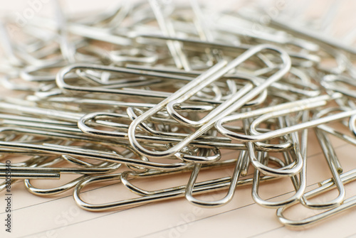 Paper clip and pink paper