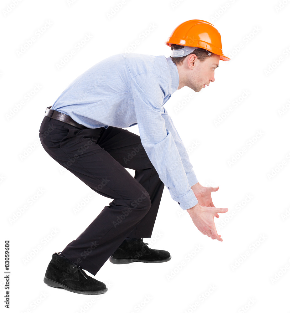 Backview of an engineer in construction helmet. Backview of an engineer in construction helmet.