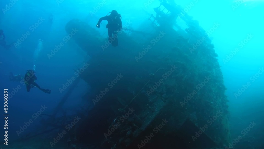 Diver visiting the stern of the wreck Giannis D, Red Sea Diver visiting the stern of the wreck Giannis D, Red Sea
