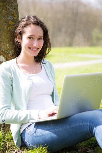 Young attractive woman realxing at the park
