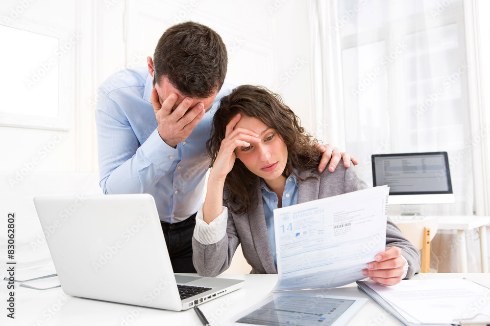 Young attractive couple doing paperwork