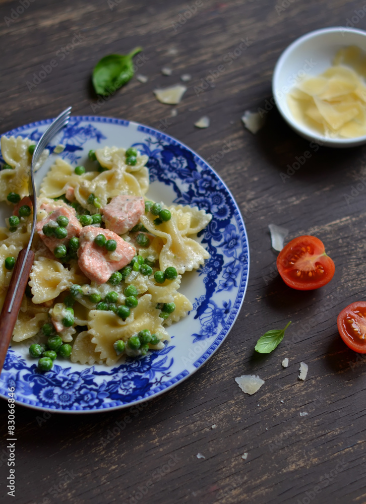 pasta with salmon and green peas in a creamy sauce 