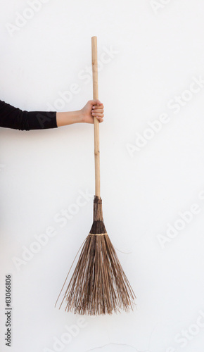A woman holding a broom
