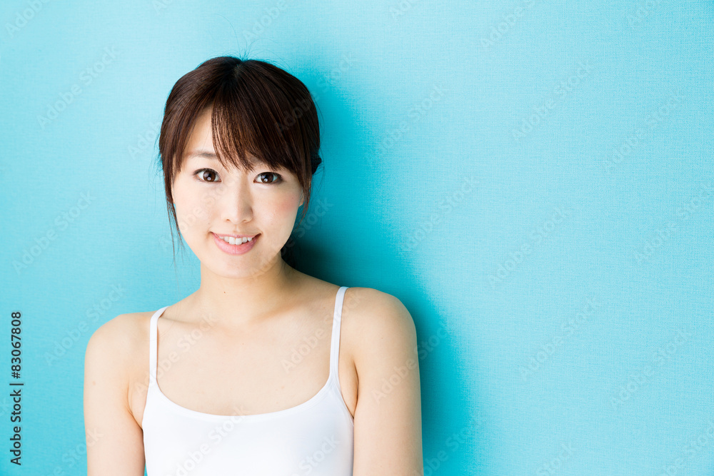 attractive asian woman beauty image on blue background attractive asian woman beauty image on blue background