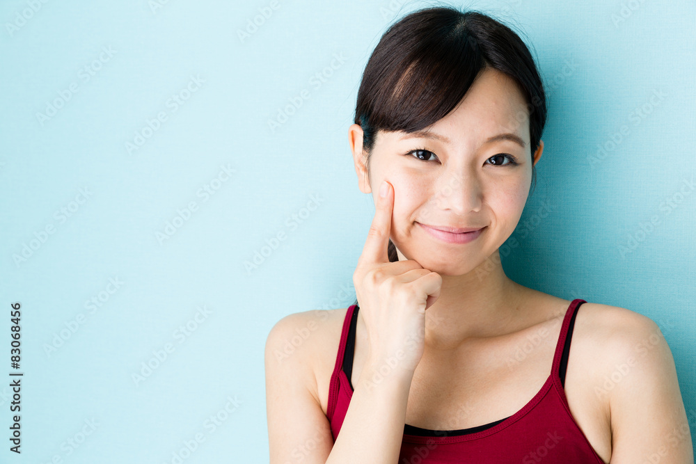 attractive asian woman beauty image on blue background attractive asian woman beauty image on blue background