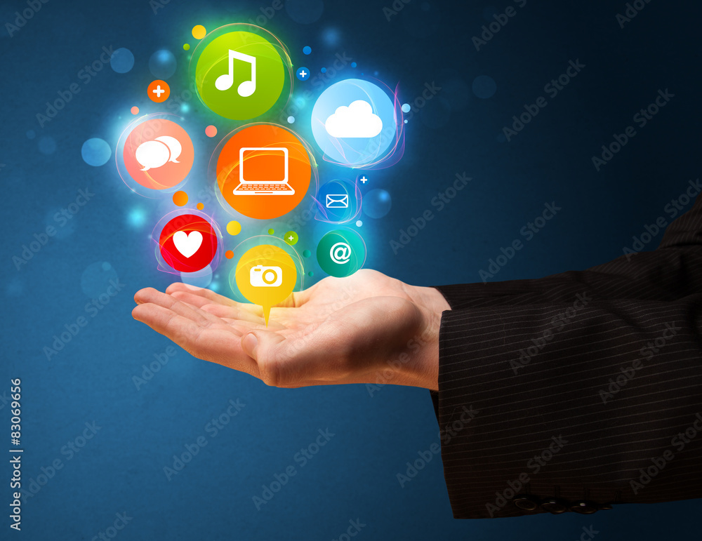 Naklejka premium Multimedia icons in the hand of a businessman