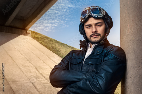 Retro Pilot Portrait with Glasses and Vintage Helmet photo