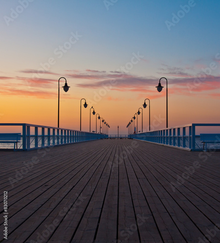 Beautiful colorful Sunrise on the pier at the seaside © R_Szatkowski