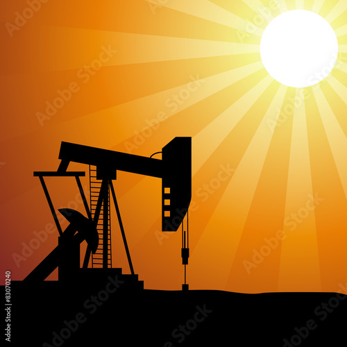 Oil well silhouette on sunset
