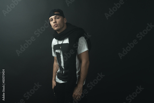Fashionable stylish man in  darkness
