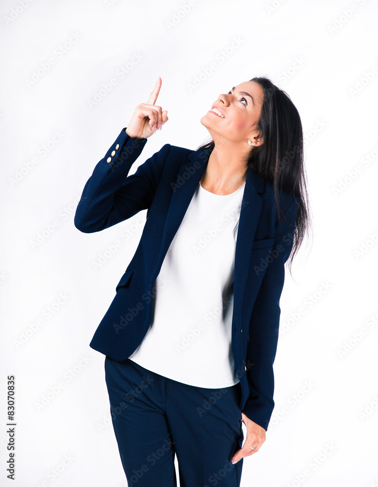 Smiling businesswoman pointing finger up Smiling businesswoman pointing finger up