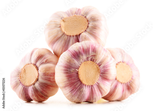 Composition with bulbs of garlic isolated on white