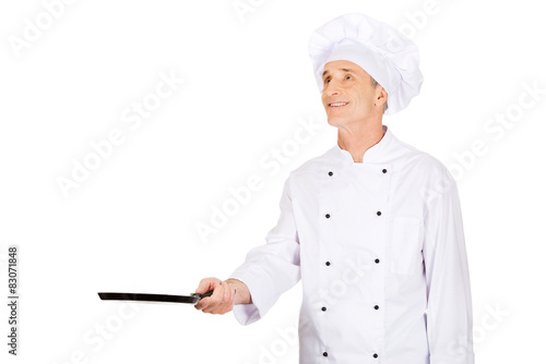 Restaurant chef with frying pan photo