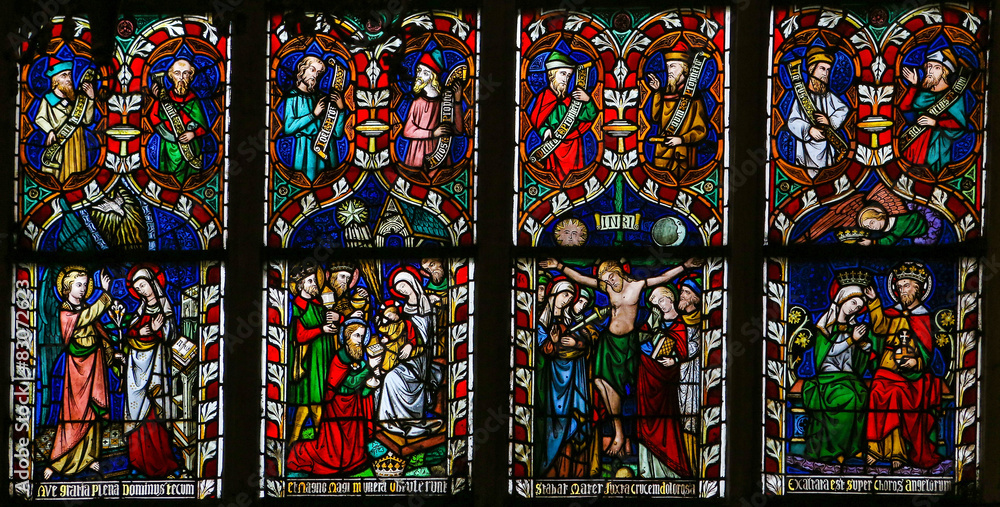Stained glass window depicting scenes in the life of Mother Mary
