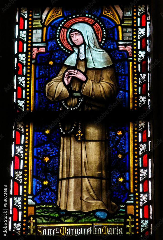 Stained glass window depicting the Catholic Saint Margaret Mary